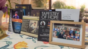 A small collection of brochures and pictures from the concerts that Azariah has performed at, including one in support of “Very Special Arts” Singapore.